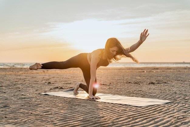 doing-asana-yoga-exercises-outdoors-coach-woman-balance-harmony-fitness-training_283470-8925